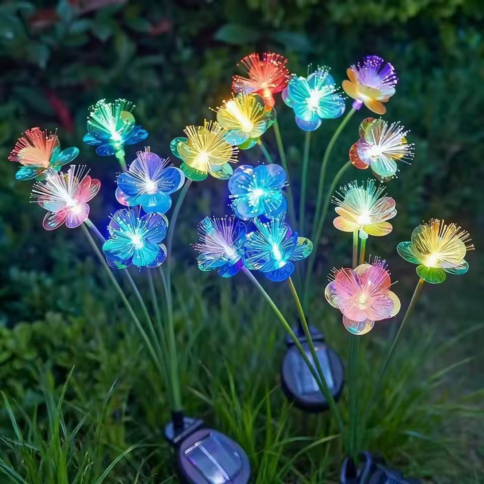 Estaca Solar Flor RGB encendida de noche